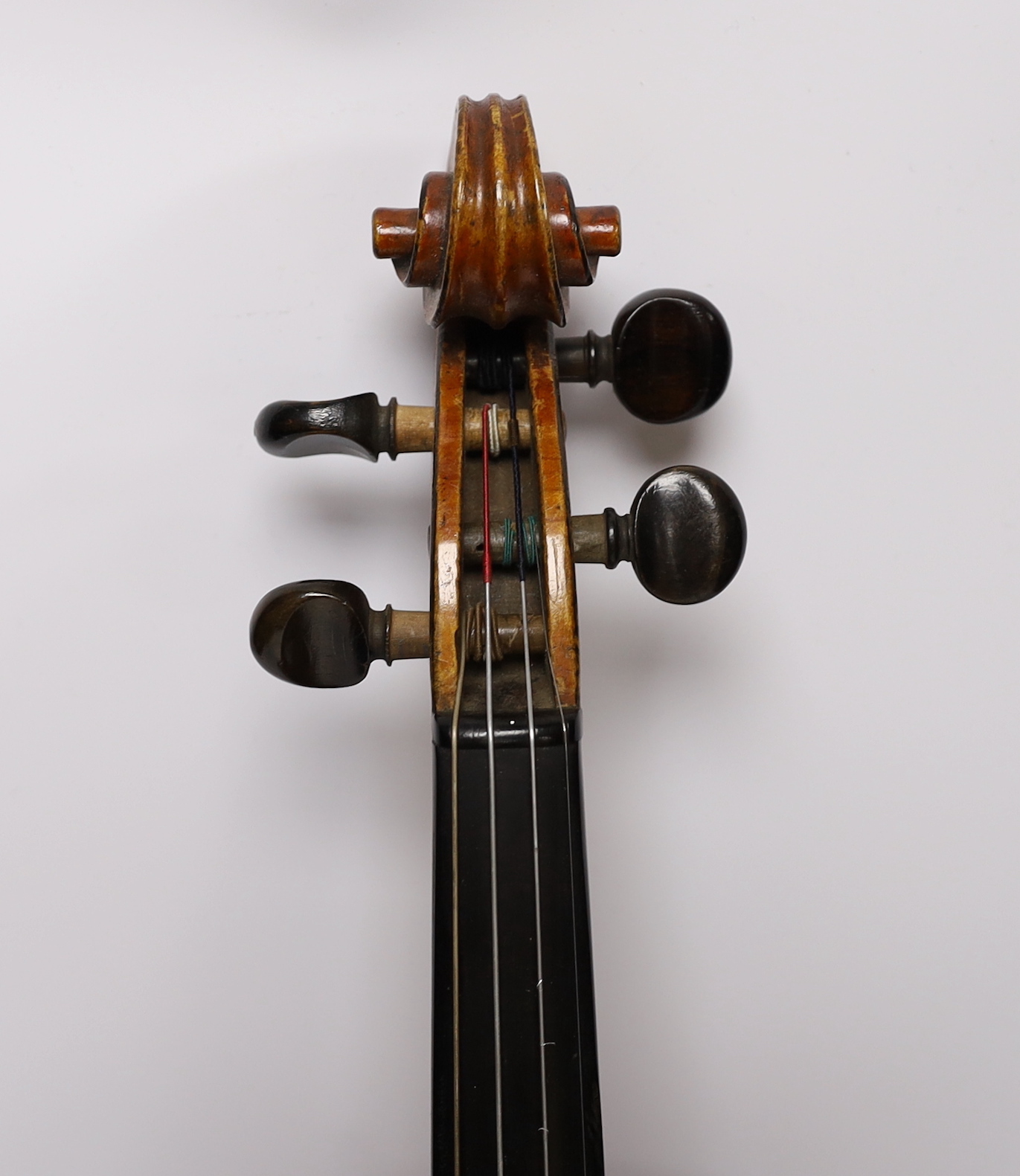 A cased late 19th/early 20th century French violin, bears Joseph Guarnerius label